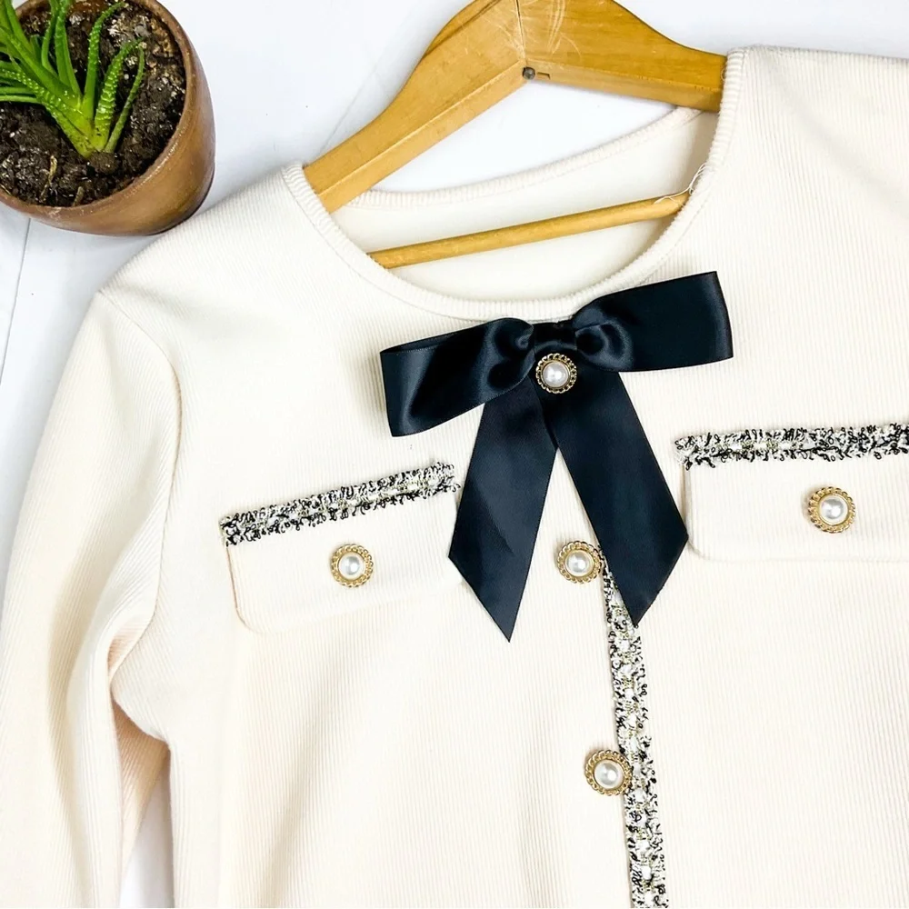 Elegant Cream Dress with Black Bow & pearl details - Picture 2 of 11